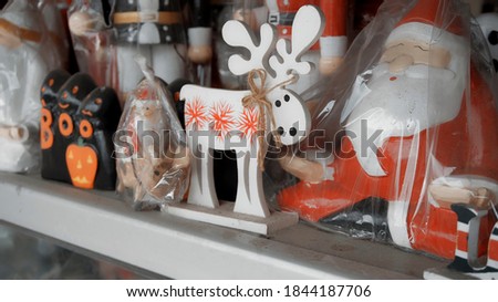 Little wooden Christmas toys deer and angels stay at house