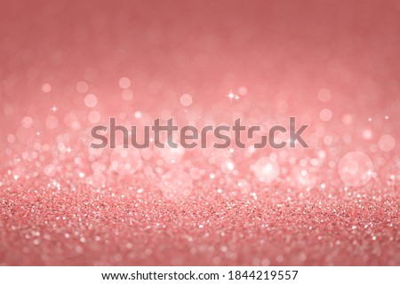 Coral abstract defocused bokeh background. Sparkling texture.