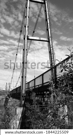 black and white photos in summer. pedestrian bridge with different viewing angle.