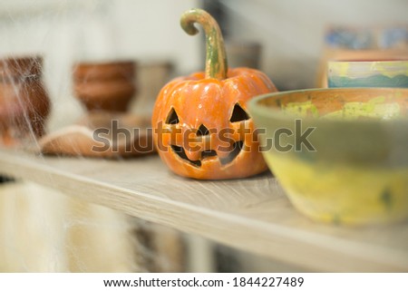 Halloween pumpkin and food on the table