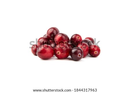 Heap of fresh cranberries isolated on white background. Many red berries. Autumn large cranberries