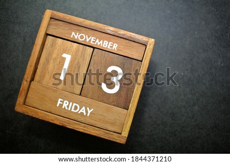 Friday 13th, November on wooden calendar. bad luck, Misfortune Day, Halloween Concept.
