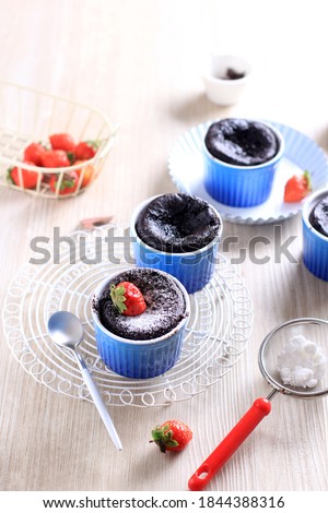 Selected Focus Shallow Doff Picture of Chocolate Mug Cake on Blue Ramequin