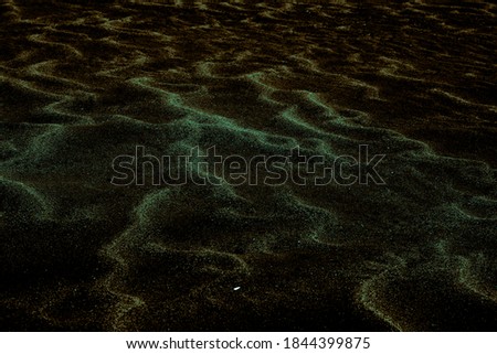 Green-brown shaded sands of the desert. Background and texture for modern design
