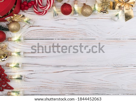 Christmas white wooden background top view. Template for New Year space for text congratulations. Holiday Greeting Cards Design. Christmas wooden background with red gift box.