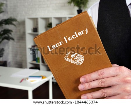 Financial concept about Loan Factory with sign on the piece of paper.
