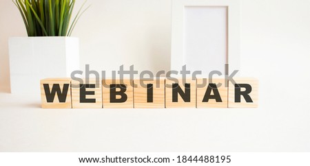 Wooden cubes with letters on a white table. White background.