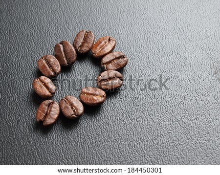 Roasted Coffee Beans on leather texture background