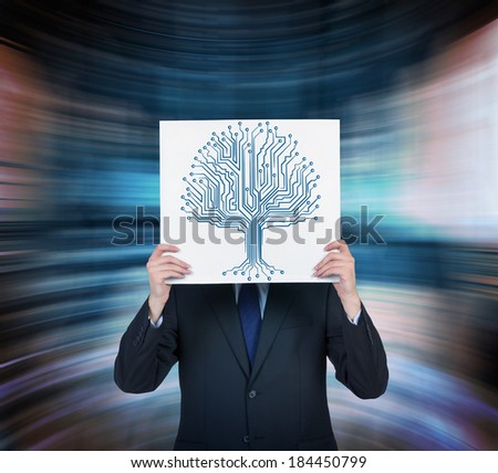 Businessman holding a poster with a picture of tree