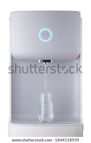 Modern technology concept. New water cooler format. A glass of pouring water. Touch panel with glowing indicator. Technological design. Close-up. Royalty-Free Stock Photo #1844518939