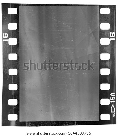 blank 35mm film frame with deep scratches on white  background.