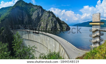 Vidraru Lake and dam. A mountain lake found in Fagaras Mountains, Romania. Royalty-Free Stock Photo #1844548519