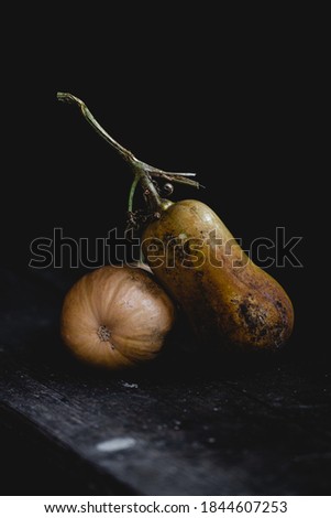 Autumn Butternut squash on table isolated on black background 