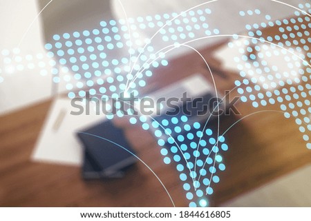 Abstract creative world map with connections and modern desktop with computer on background, international trading concept. Multiexposure