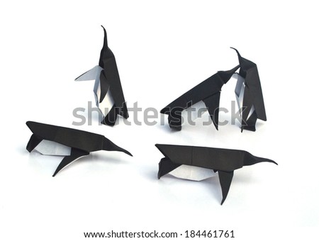 Origami penguins isolated on the white background