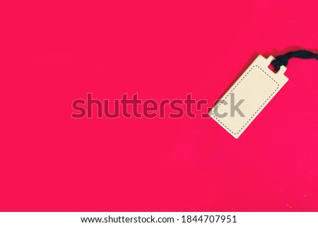 white cardboard Price tag or label isolated on pink background
