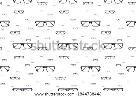 Background with glasses. Glasses with black frames. Glasses view from the top.