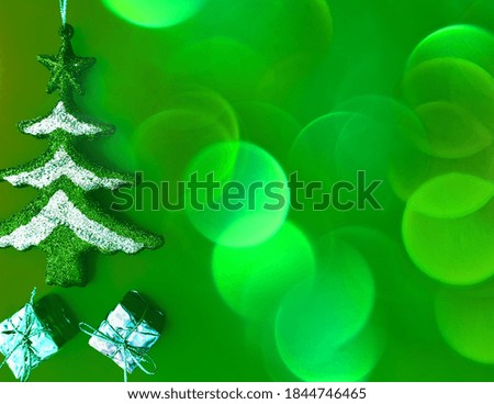christmas tree on green background with bokeh effect