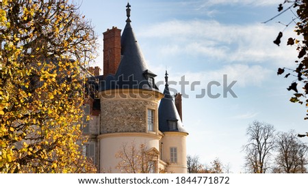 French castle and garden. A beautiful autumn morning in France. Autumn colors.
