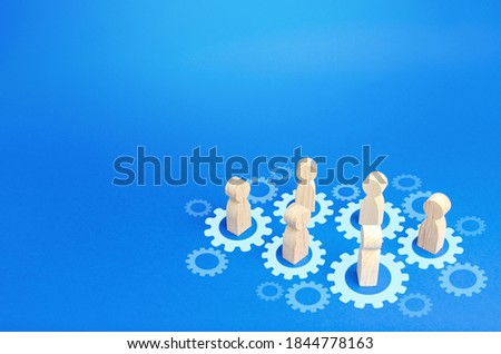 Figures of people interact with gears. Joining efforts and cooperation. Corporate machine. Communication in running company. Goal achievement. Joint development. Join team group. Teamwork Royalty-Free Stock Photo #1844778163