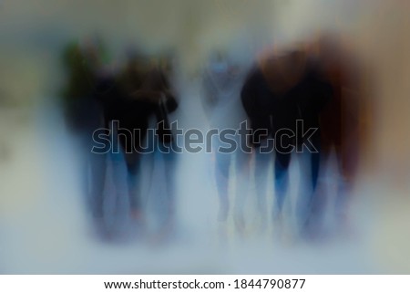 Abstract photography. Crowd of people walking somewhere in the city.

