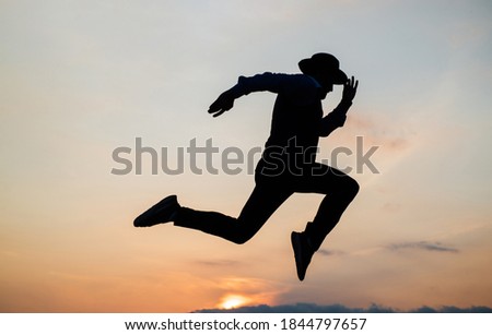 Do or Die. personal achievement goal. man silhouette jump on sky background. confident businessman running. daily motivation. enjoying life and nature. business success. freedom.