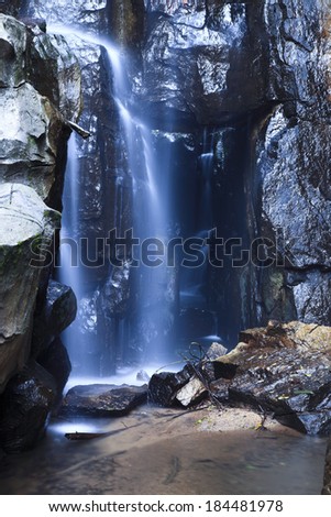 waterfall in green forest in spring