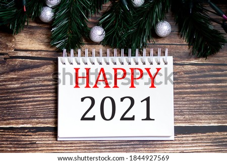 HAPPY YEAR 2021 Christmas tree concept text words on notepad