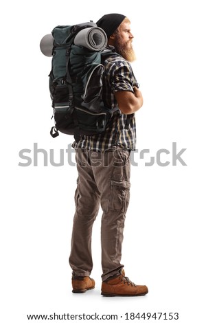 Full length shot of a young bearded man with a backpack and hiking equipment isolated on white background Royalty-Free Stock Photo #1844947153