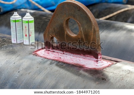 View of the dye penetrant inspection, also called liquid penetrate inspection or penetrant testing (PT). It is a widely applied and low-cost inspection method used to check surface-breaking defects. Royalty-Free Stock Photo #1844971201