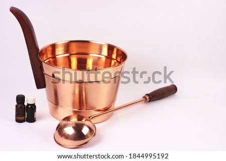 Bath accessories as a copper bucket and ladle composition isolated over white background.Bathhouse, sauna, hygiene and health care concept.copy space for text. Royalty-Free Stock Photo #1844995192