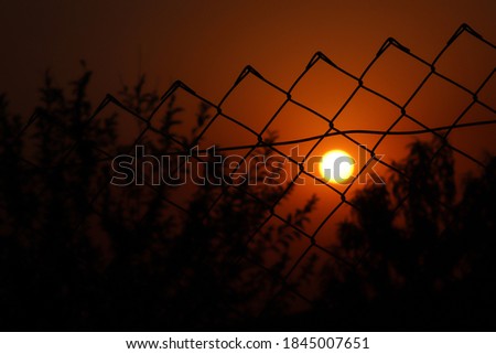 sunset between the wire in the evening
