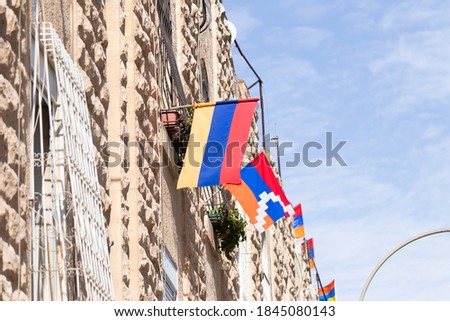 Flags of Armenia and Nagorno-Karabakh on the walls of buildings in the Armenian Quarter near the Zion Gate in the old city of Jerusalem, Israel