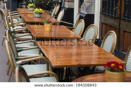 Small cafe tables outside on a street
