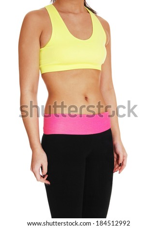 A closeup body picture of a slim Chinese woman in exercise clothing standing for white background. 