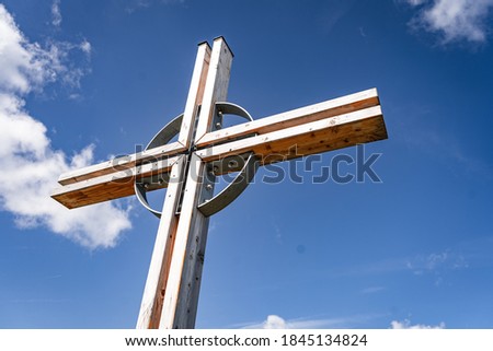 Cross in front of a blue sky