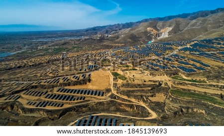 Aerial photography of outdoor mountain solar photovoltaic in Asia
