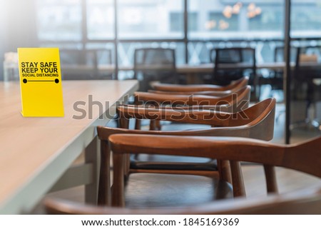 close up modern design chair in conference room with social distancing signage on table new normal lifestyle
