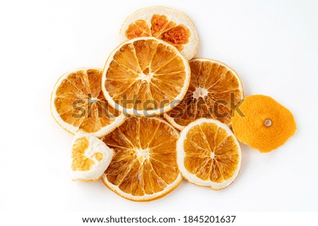 background texture with dried orange citrus slices on a white background