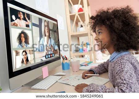 African kid child girl distance learning during virtual distance online class on video conference call with teacher, tutor and school children group studying at home. Elearning zoom class on computer. Royalty-Free Stock Photo #1845249061