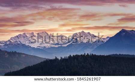 Glowing Alps BERNER OBERLAND swiss mountains sunset Royalty-Free Stock Photo #1845261907