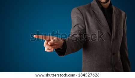 Young businessman pressing imaginary button
