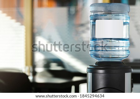 Large water dispenser in the office, with cold and hot taps. Royalty-Free Stock Photo #1845294634
