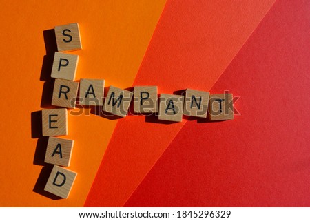 Rampant, Spread, words in wooden alphabet letters in crossword form on colourful background