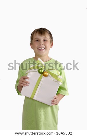 Smiling child holding a pretty wrapped gift