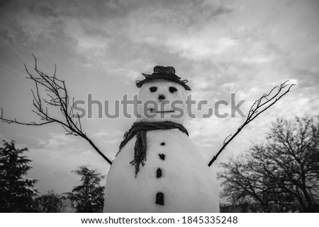 Black And white photo of snowman