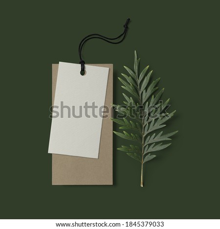 Label Tag mockup template with leaves on dark background