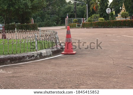 Traffic cones, fences, curb and concret roads