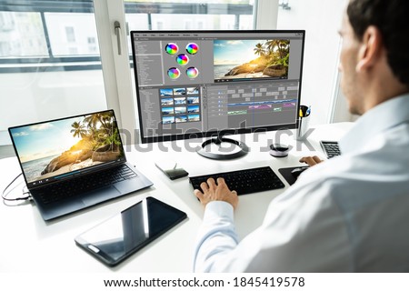 Video Editor Using Montage Software For Editing On Computer Royalty-Free Stock Photo #1845419578