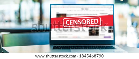 Laptop computer displaying the sign of censorship on an internet news site Royalty-Free Stock Photo #1845468790